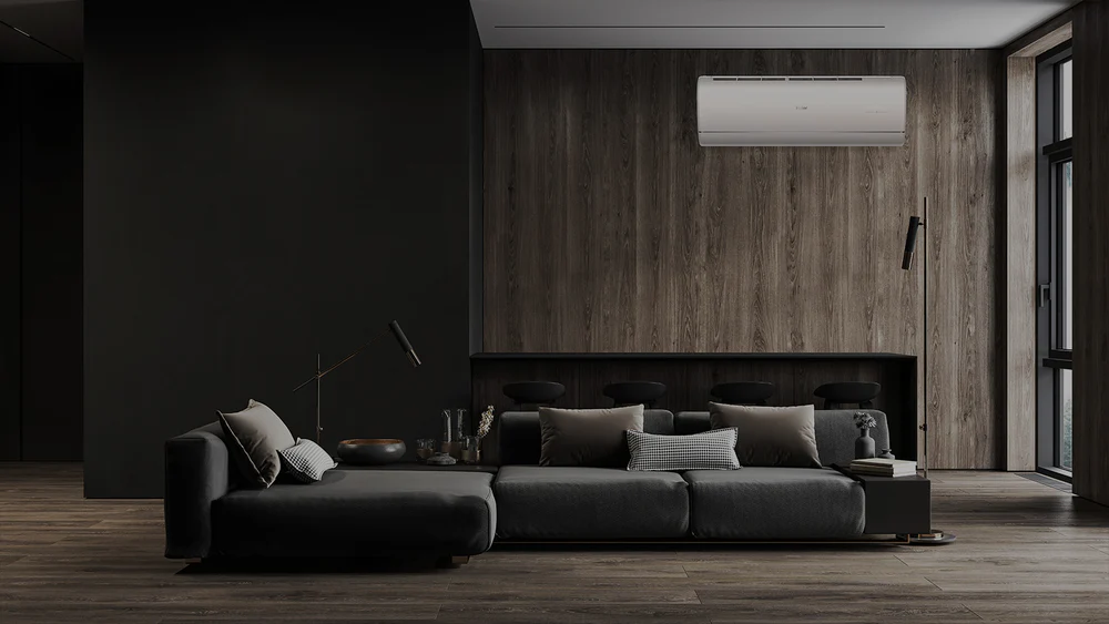 Condizionatore Haier a parete in un salotto moderno con divano angolare, pareti scure e arredamento minimalista